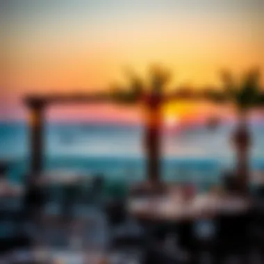 A picturesque sunset view over the beach with dining options in the foreground