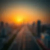 Aerial view of Sheikh Mohammed Bin Zayed Road at sunset, showcasing the cityscape.