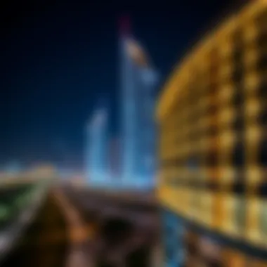 Night view of the Curve Building illuminated against the Dubai skyline